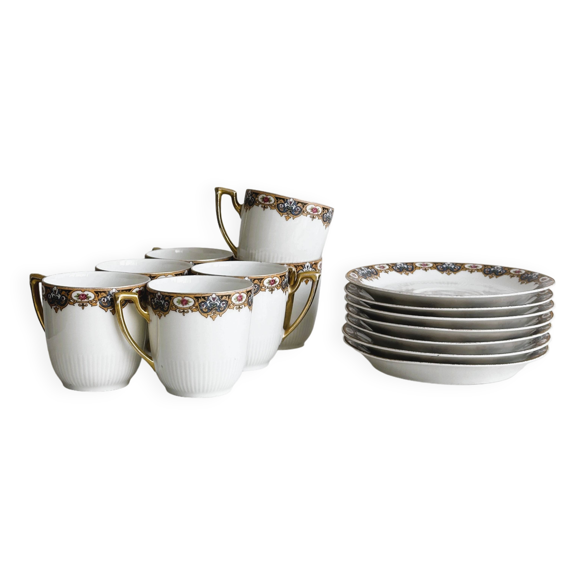 7 Limoges porcelain cups and saucers with gold decoration and floral motif.