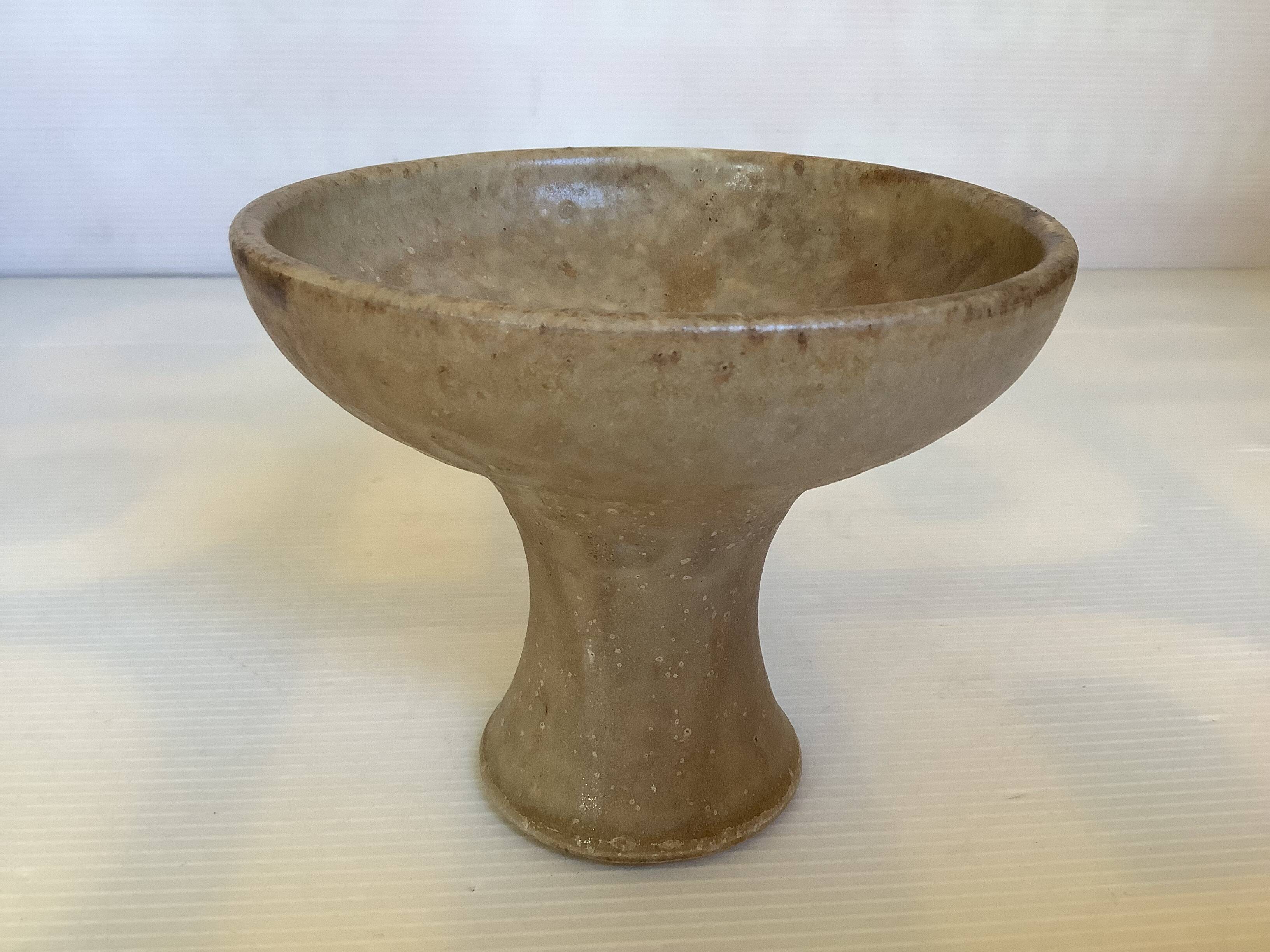 Beige ceramic chalice-shaped candle holder