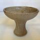 Beige ceramic chalice-shaped candle holder