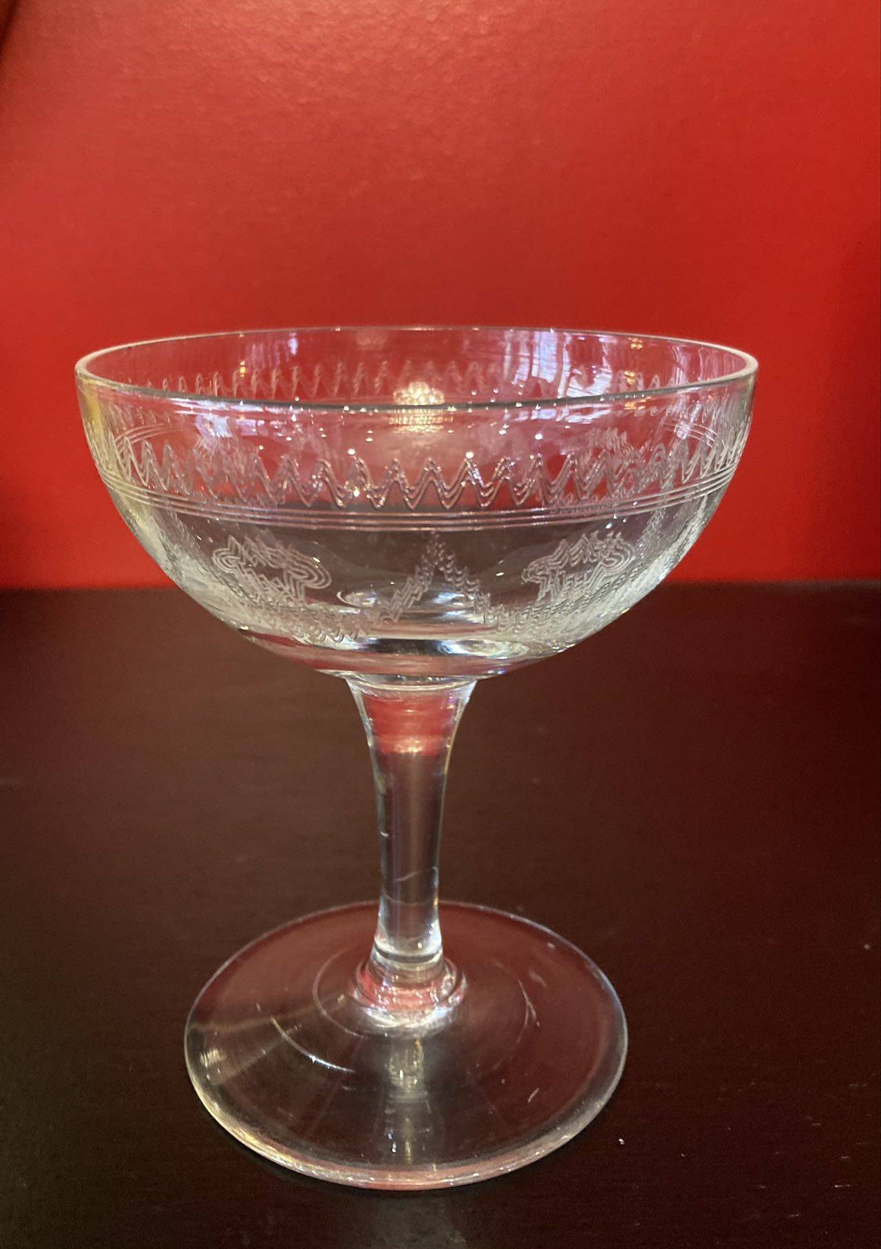 Early 20th century champagne glass burst by hand