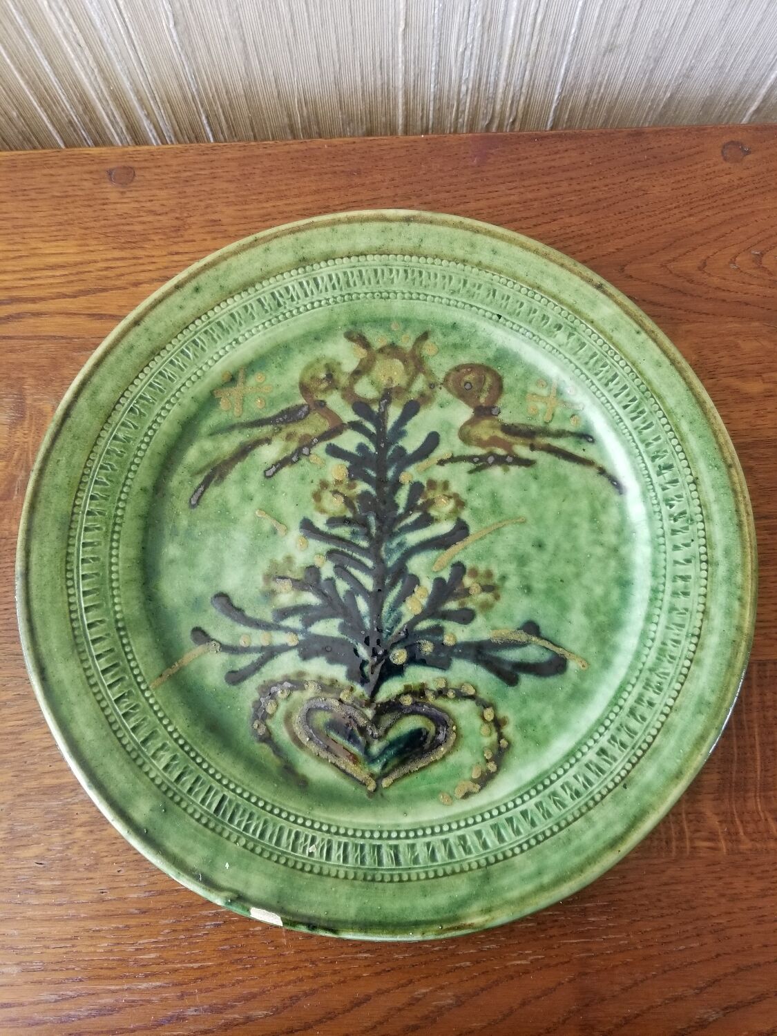 Green earth dish with a pattern from the manufacture Saint Jorioz Annecy