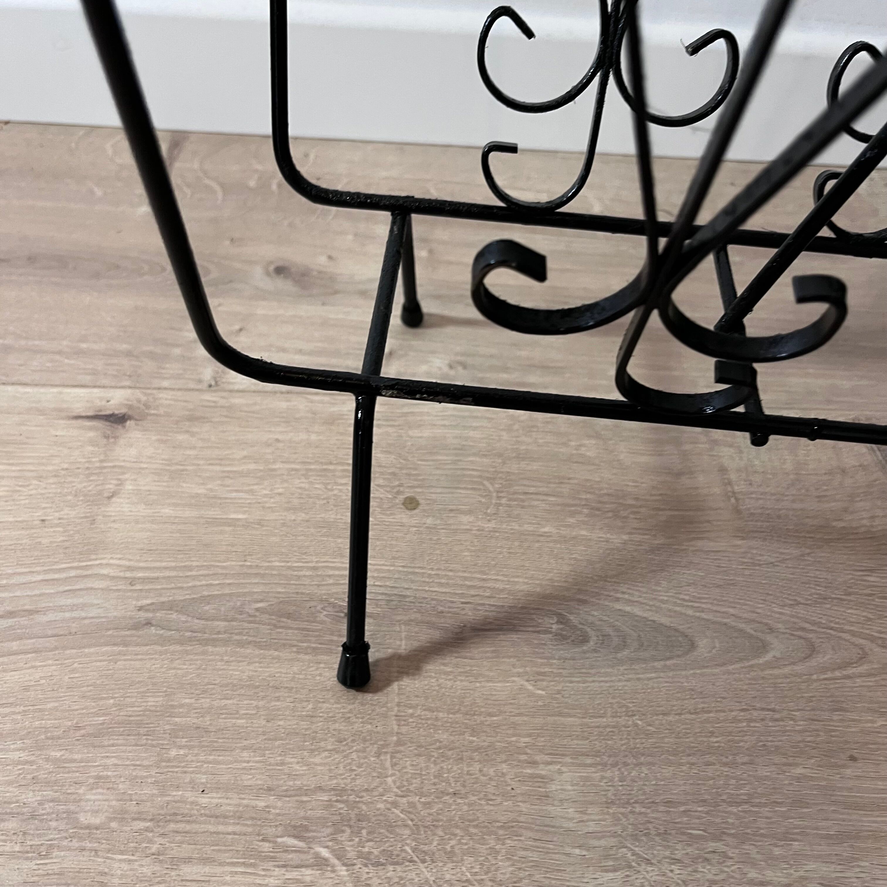 Black steel magazine holder