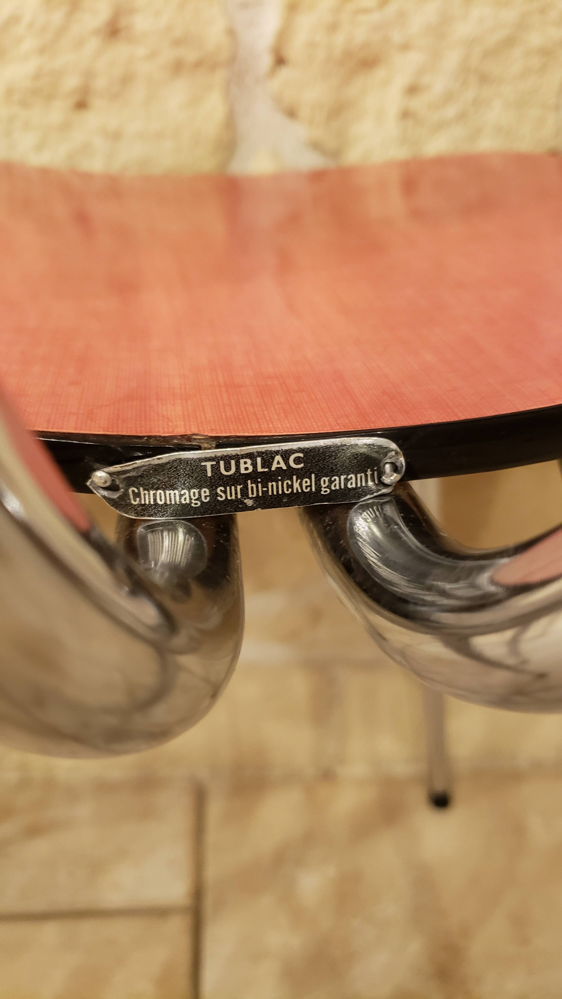Pair of red tublac formica chairs with chrome metal legs