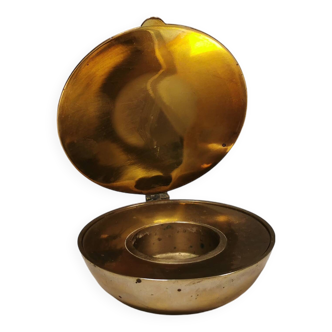 A  brass candleholder for tea lights by Magnus Löfgren, model “Shell”, Design House Stockholm 1993