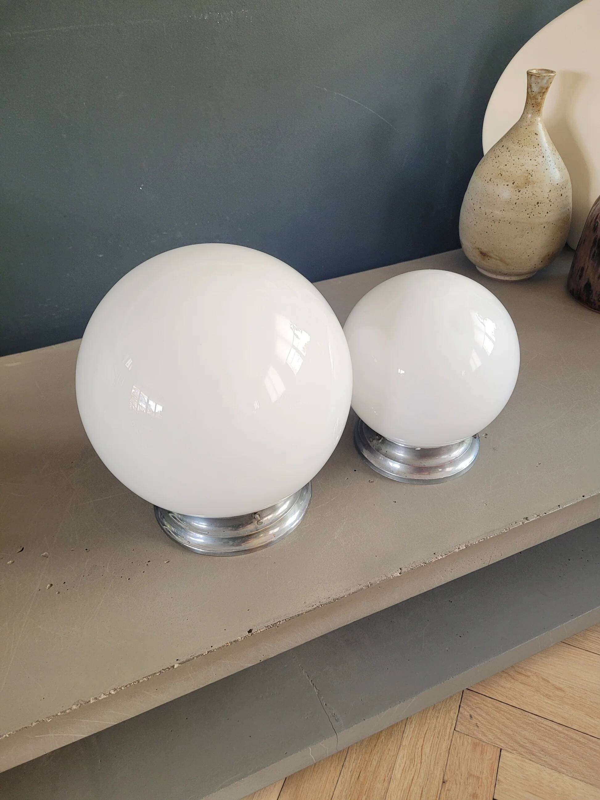 Pair of ceiling lights or wall lights with white glass globes.