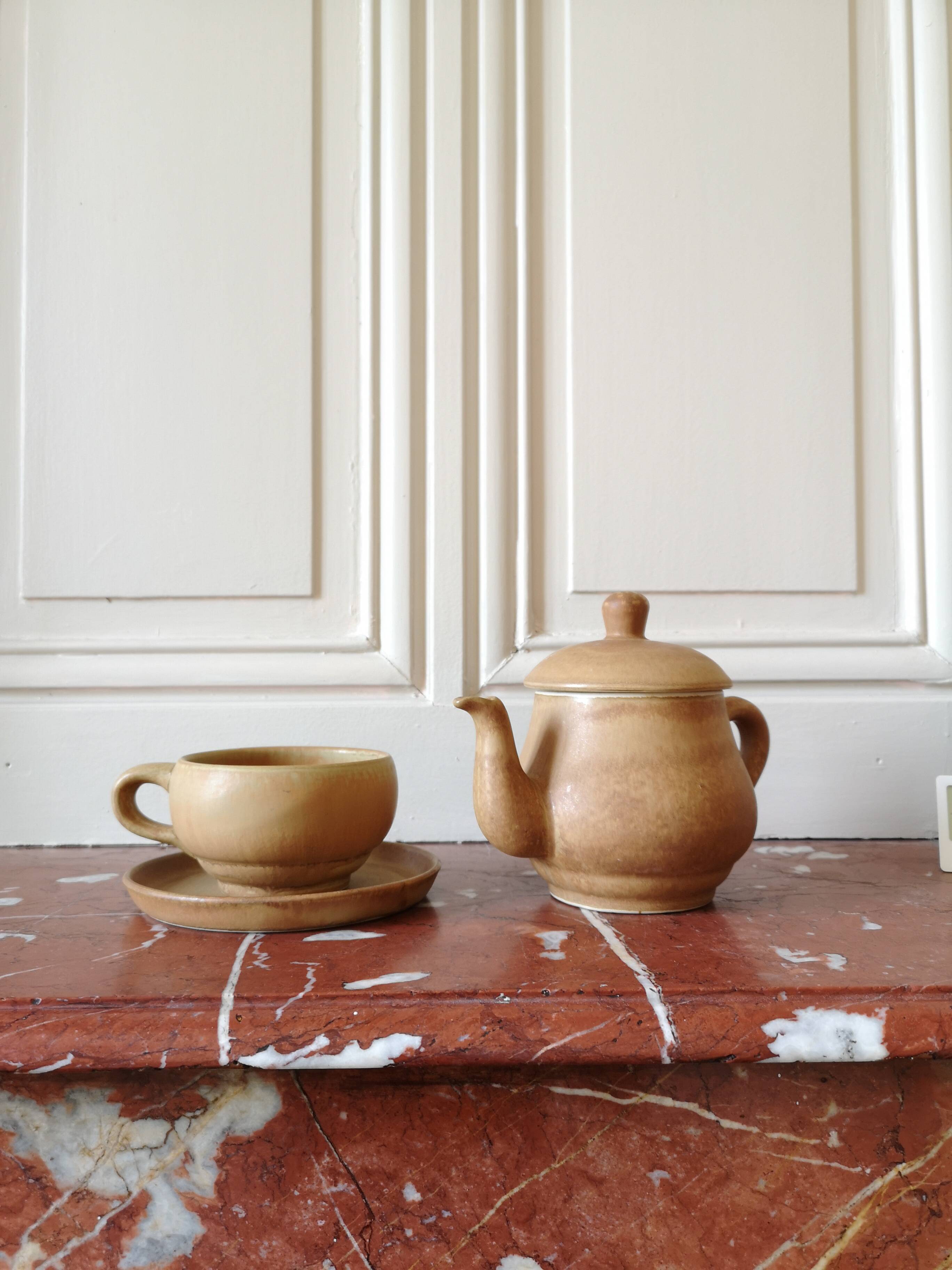 Vintage stoneware teapot and cup, "selfish" tea service, signed