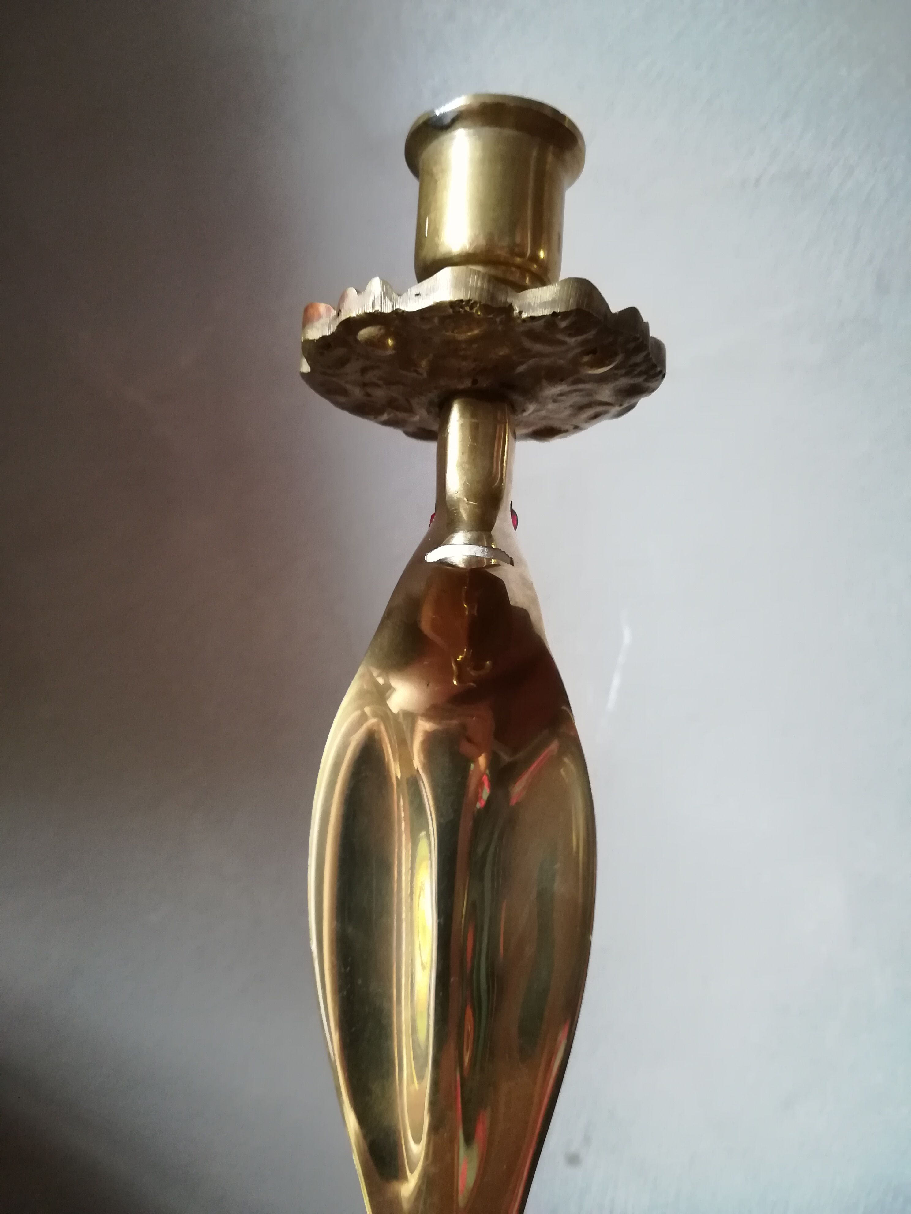 Candlestick mounted on brass cobra