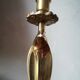 Candlestick mounted on brass cobra