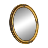 Oval-shaped gilded wooden mirror