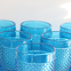Old table set in blue pressed moulded glass