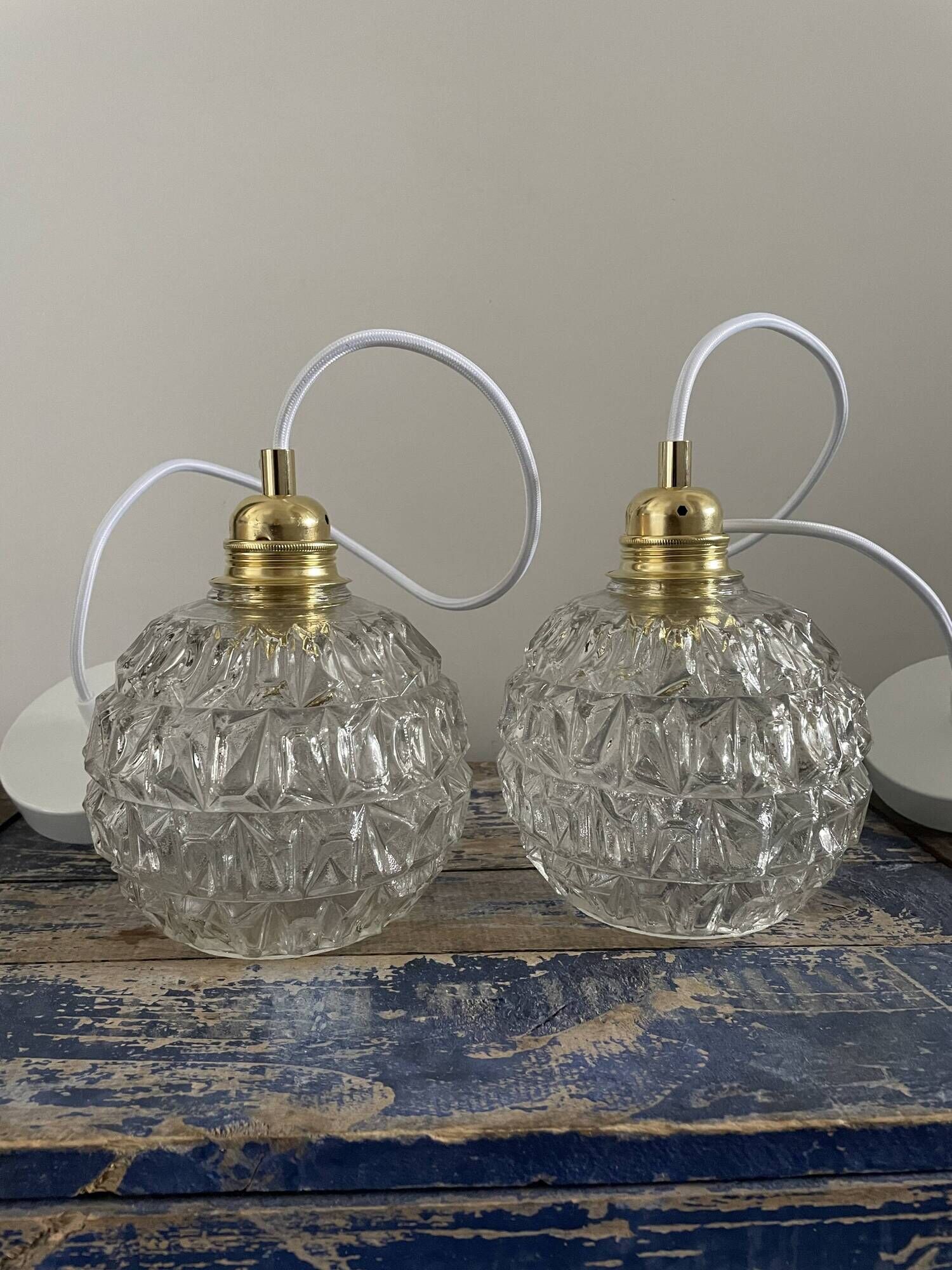 Set of two vintage electrified glass pendant lamps