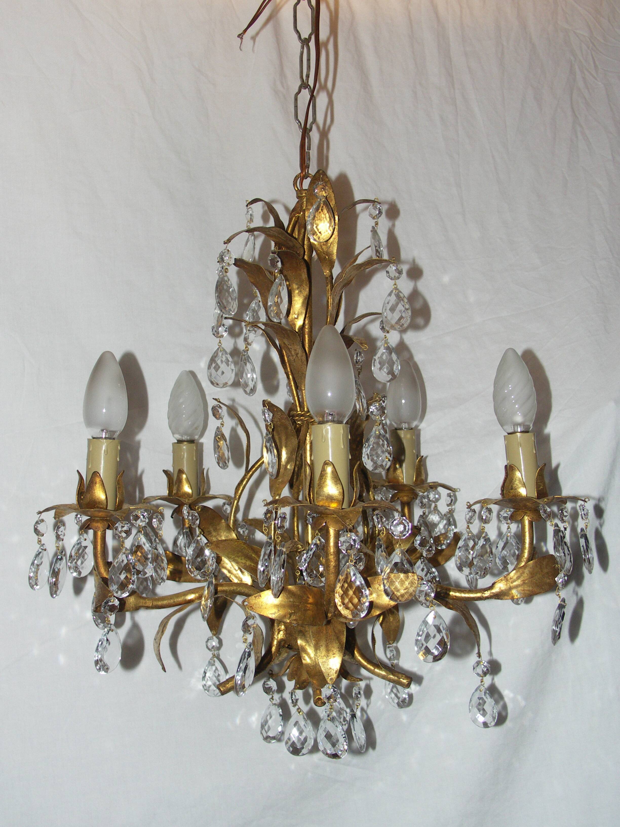 Very pretty chandelier with tassels and leaves in gold sheet metal.