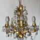 Very pretty chandelier with tassels and leaves in gold sheet metal.