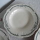 4 assiettes semi creuses terre de fer Longchamp