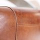 Pair of vintage lounge chairs Demon/Aviator in cognac leather and polished steel, Art Deco style.