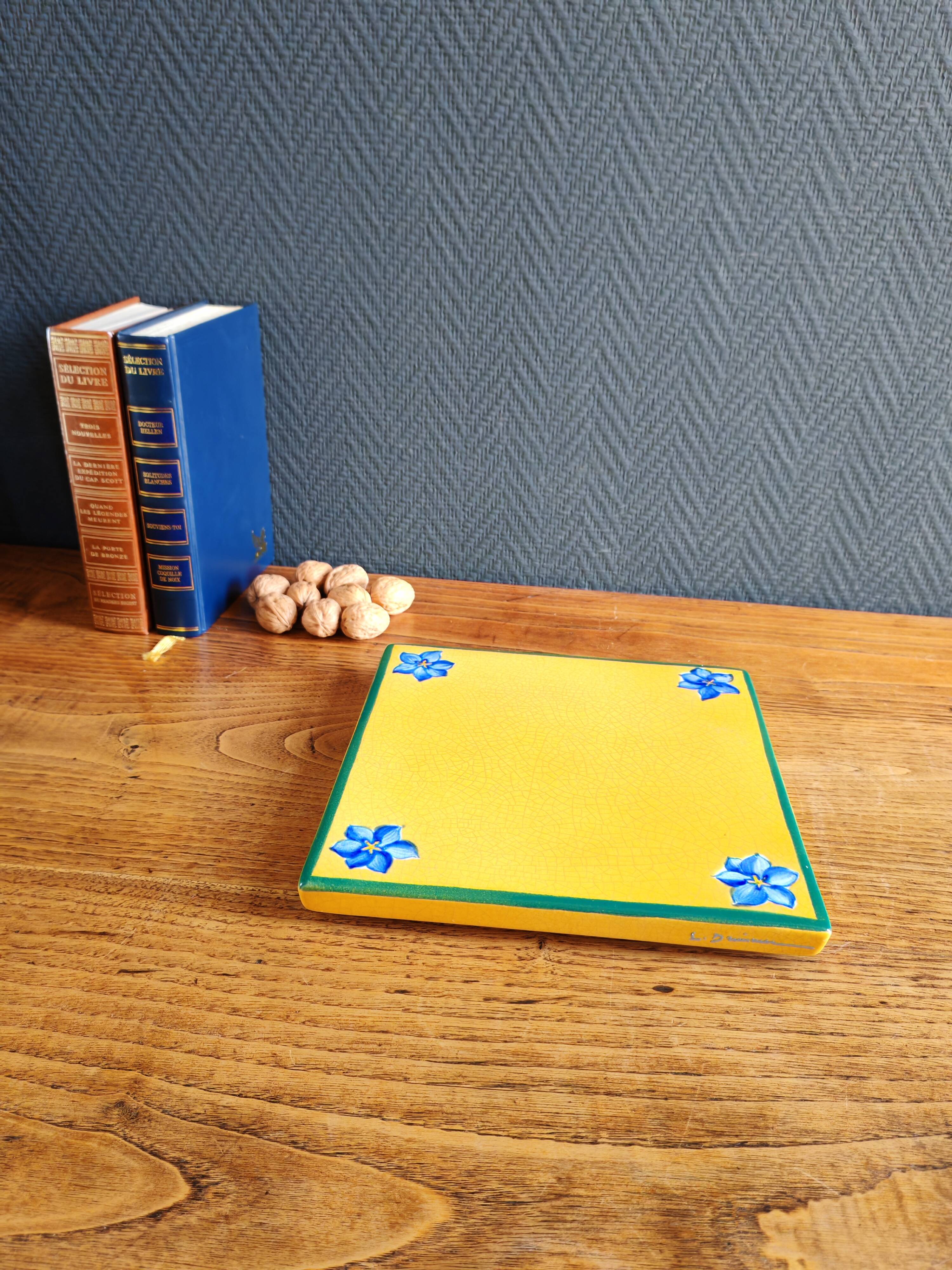 Yellow glazed ceramic trivet signed l. drimmer