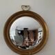 Miroir œil de sorcière vintage en bois doré