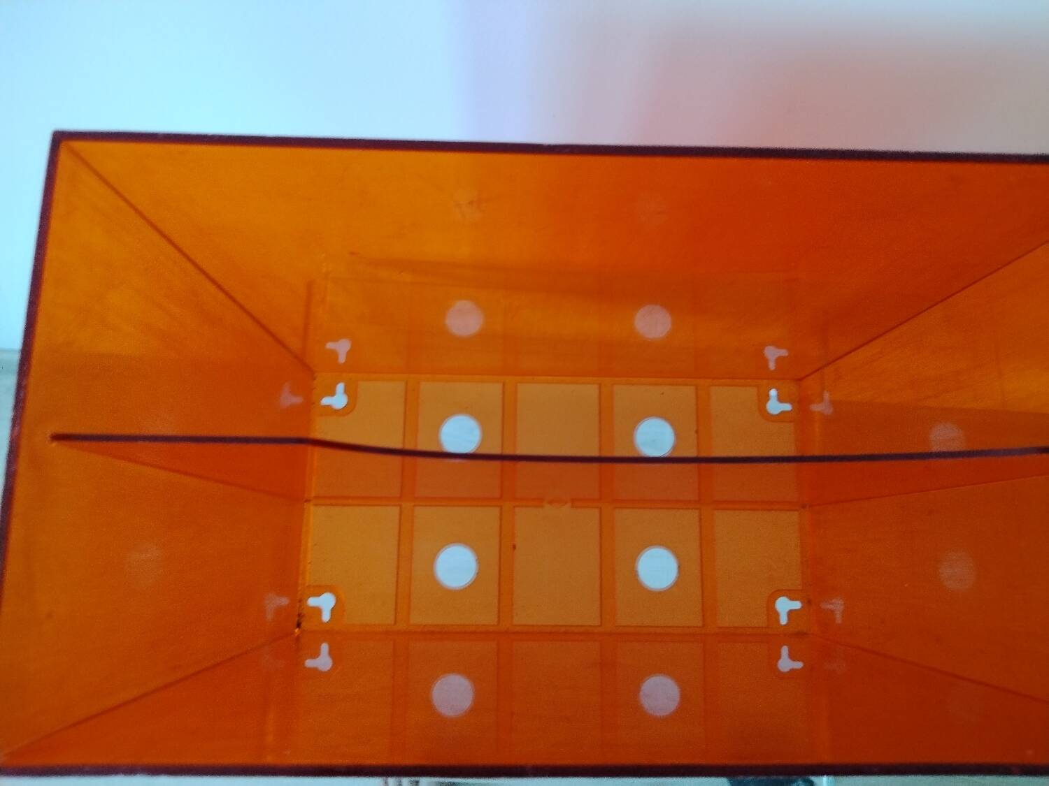 Vinyl magazine holder in orange plexiglass