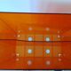 Vinyl magazine holder in orange plexiglass