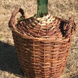 Glass cylinder with wicker casing