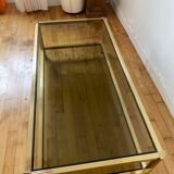 Gold metal coffee table and smoked glass