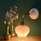 Vintage pink and clear glass elbow wall light.