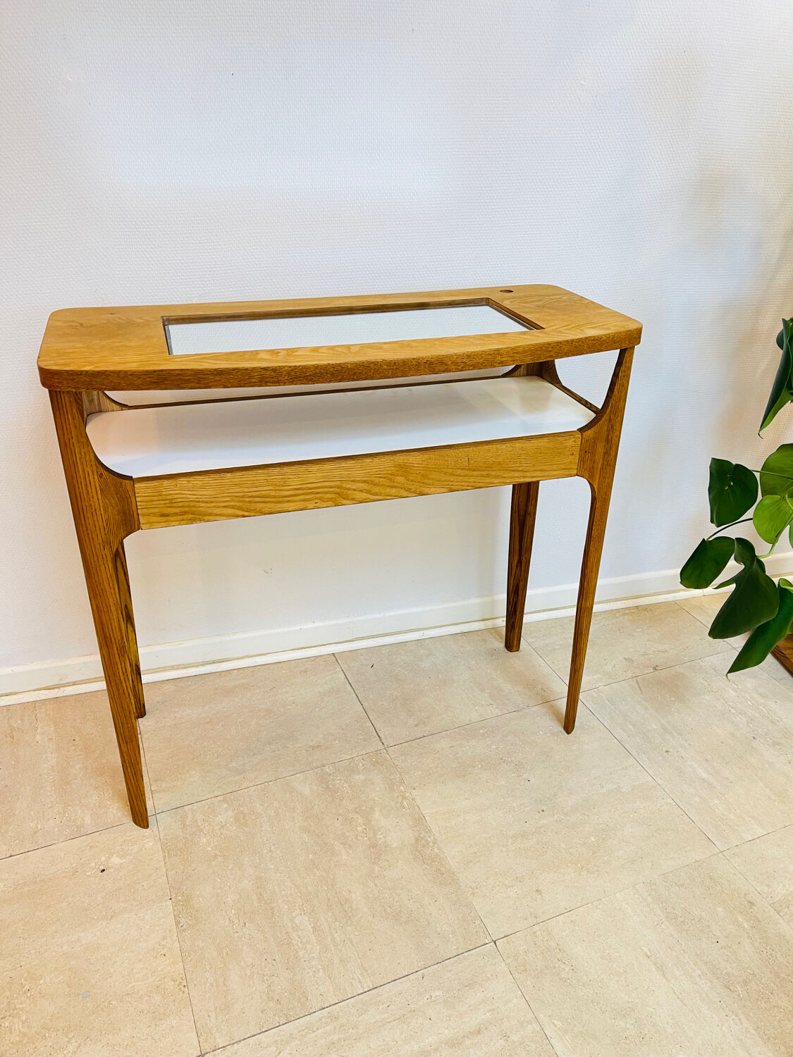 Small contemporary console in stained walnut wood.
