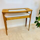 Small contemporary console in stained walnut wood.