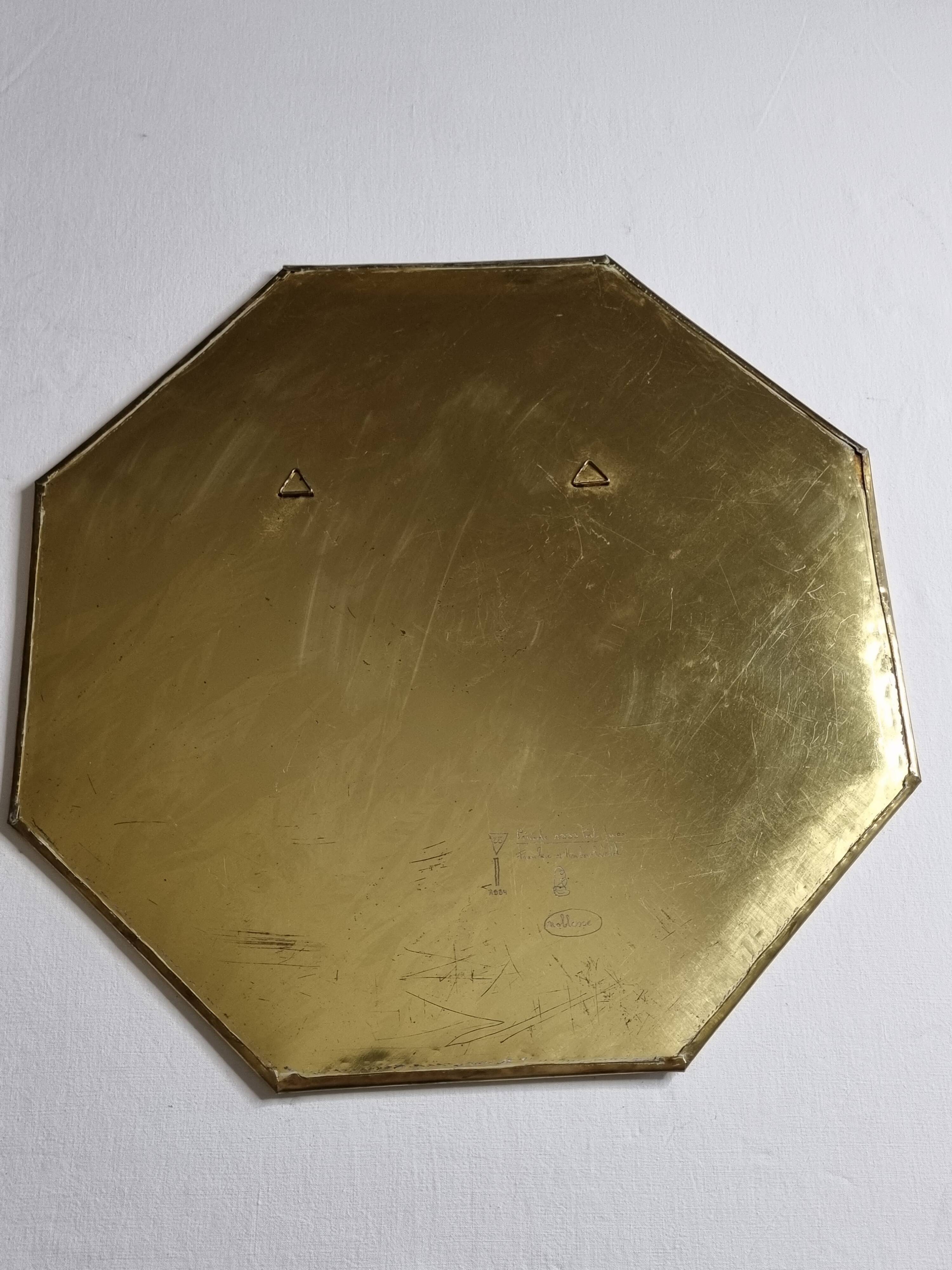 Octagonal brass mirror signed Frankie d'Homborchveld, 47 x 50 cm