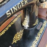 Old Singer sewing machine on its original base