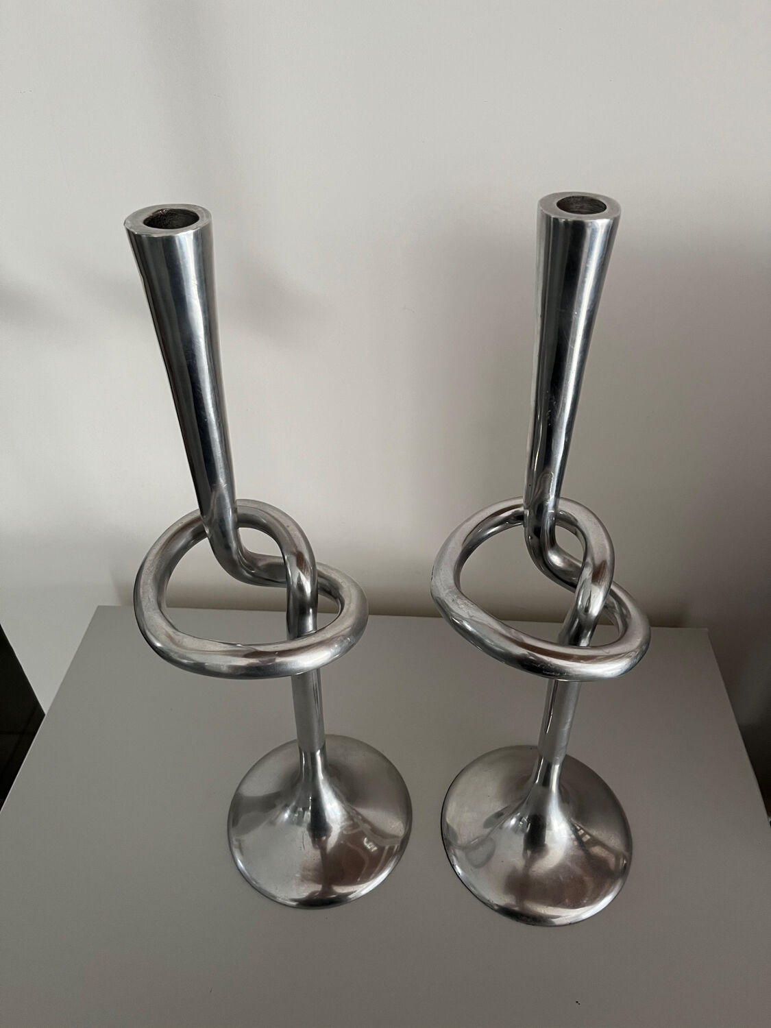 Pair of large kare design cast aluminum candlesticks