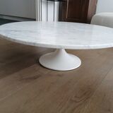 Round marble coffee table with tulip base.