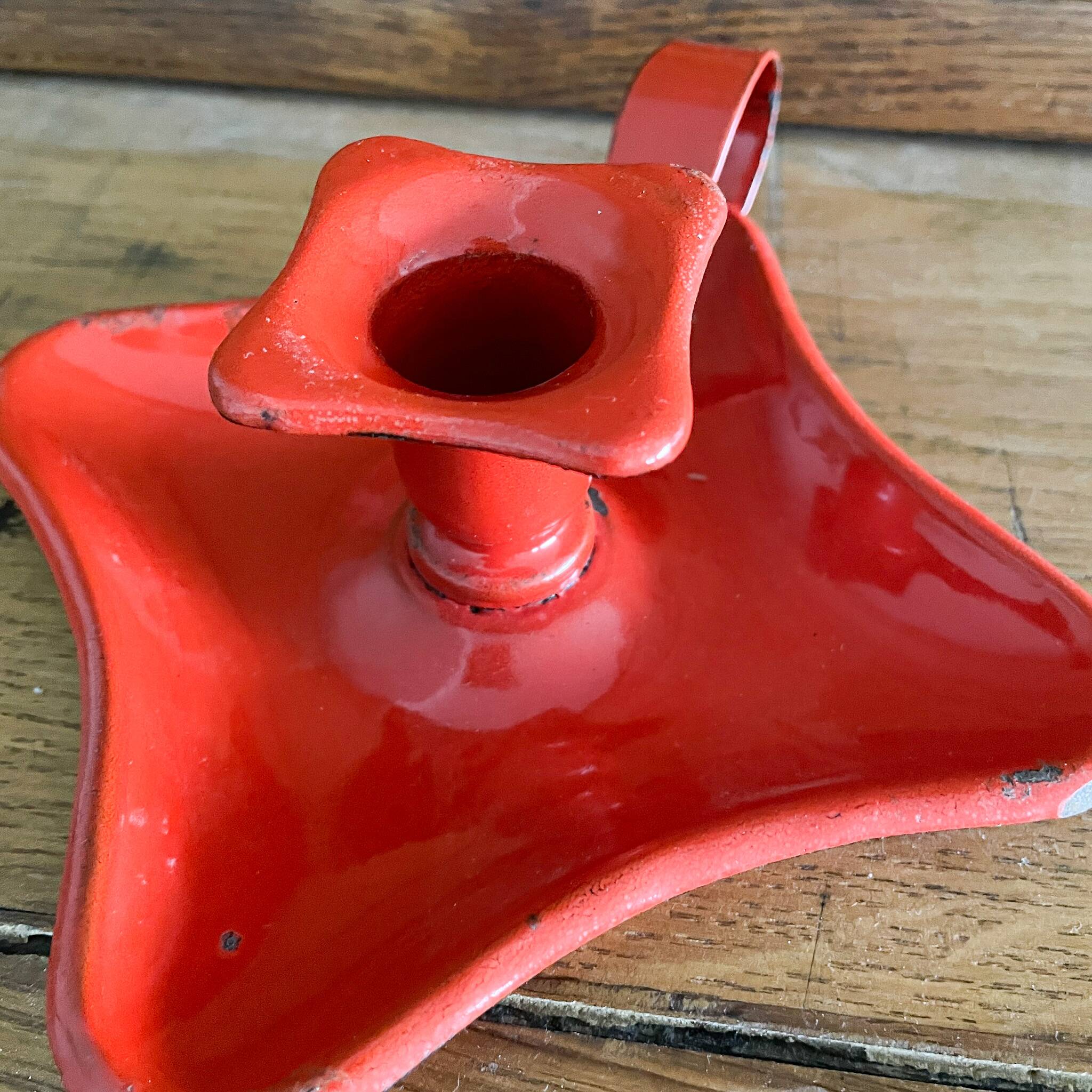 Red enamelled sheet metal candle holder
