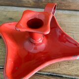 Red enamelled sheet metal candle holder