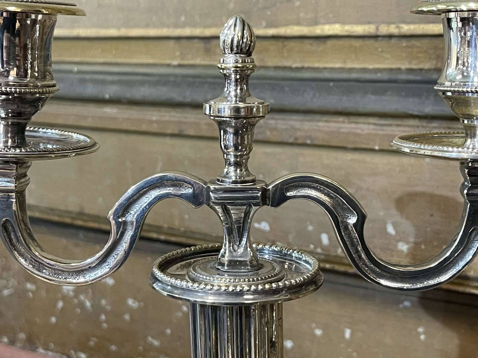 Pair of 2-branched candlesticks in silver metal