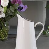 Old white enameled pitcher