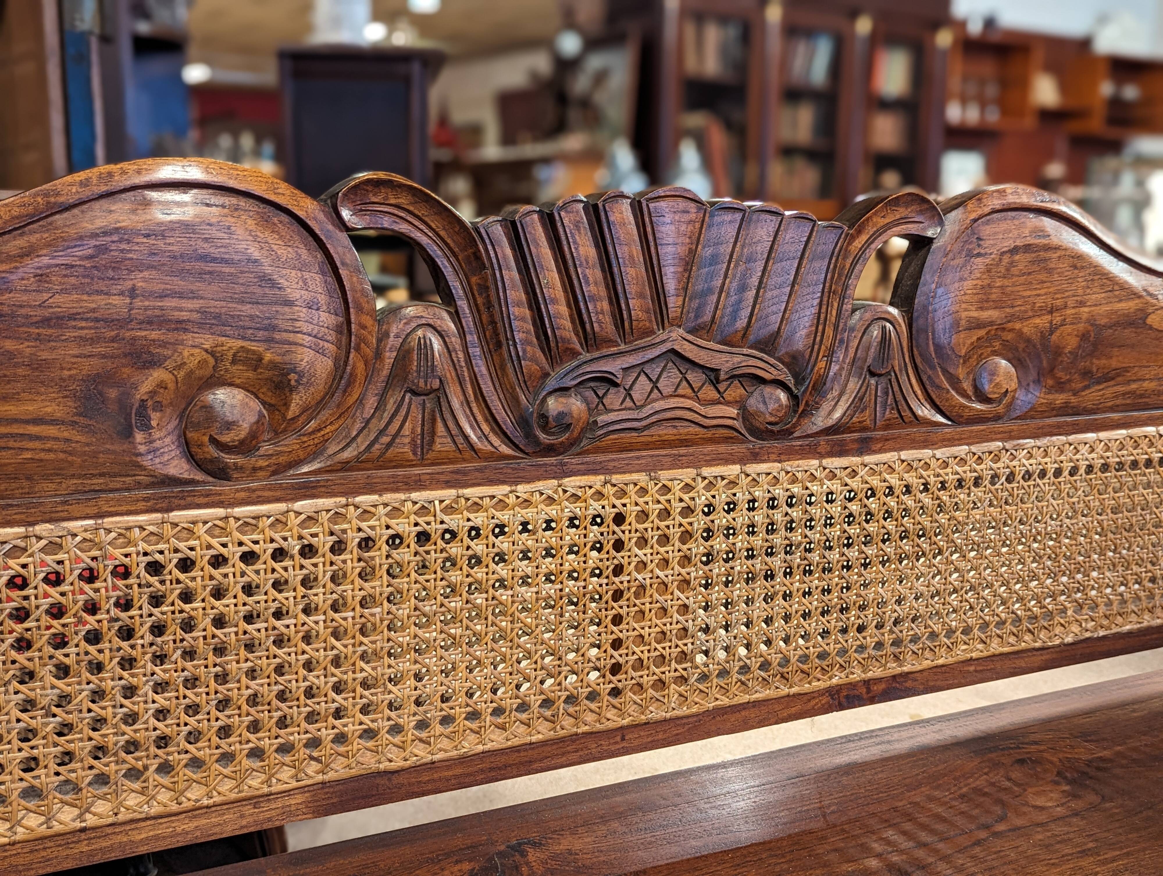 Large colonial caned bench