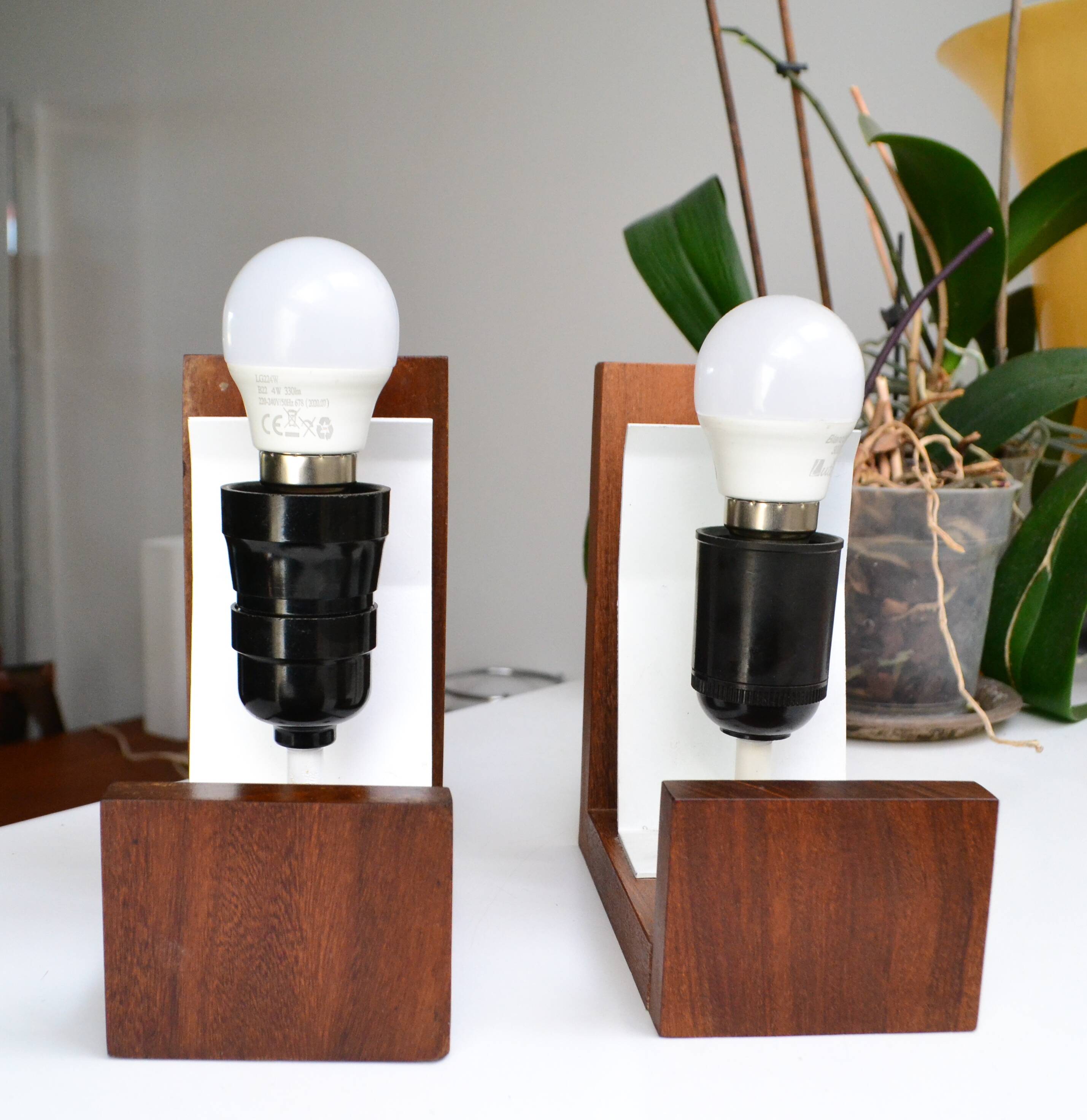 Pair of Louis Kalff opaline and teak wall lights from the 1950s/60s