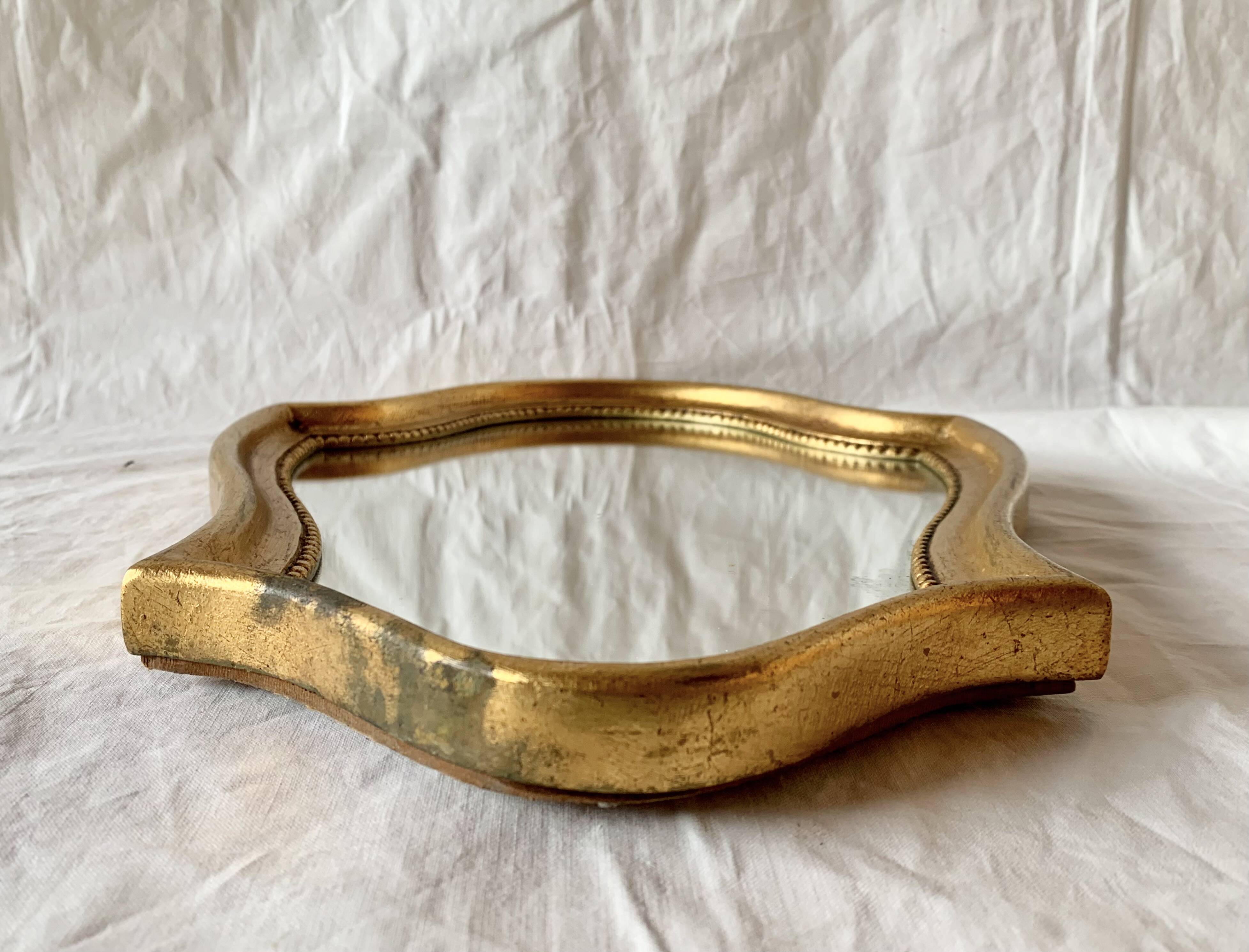 Vintage wall mirror in gilded wood