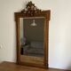 Miroir doré fin 19ème avec  fronton décoré. 150x82.