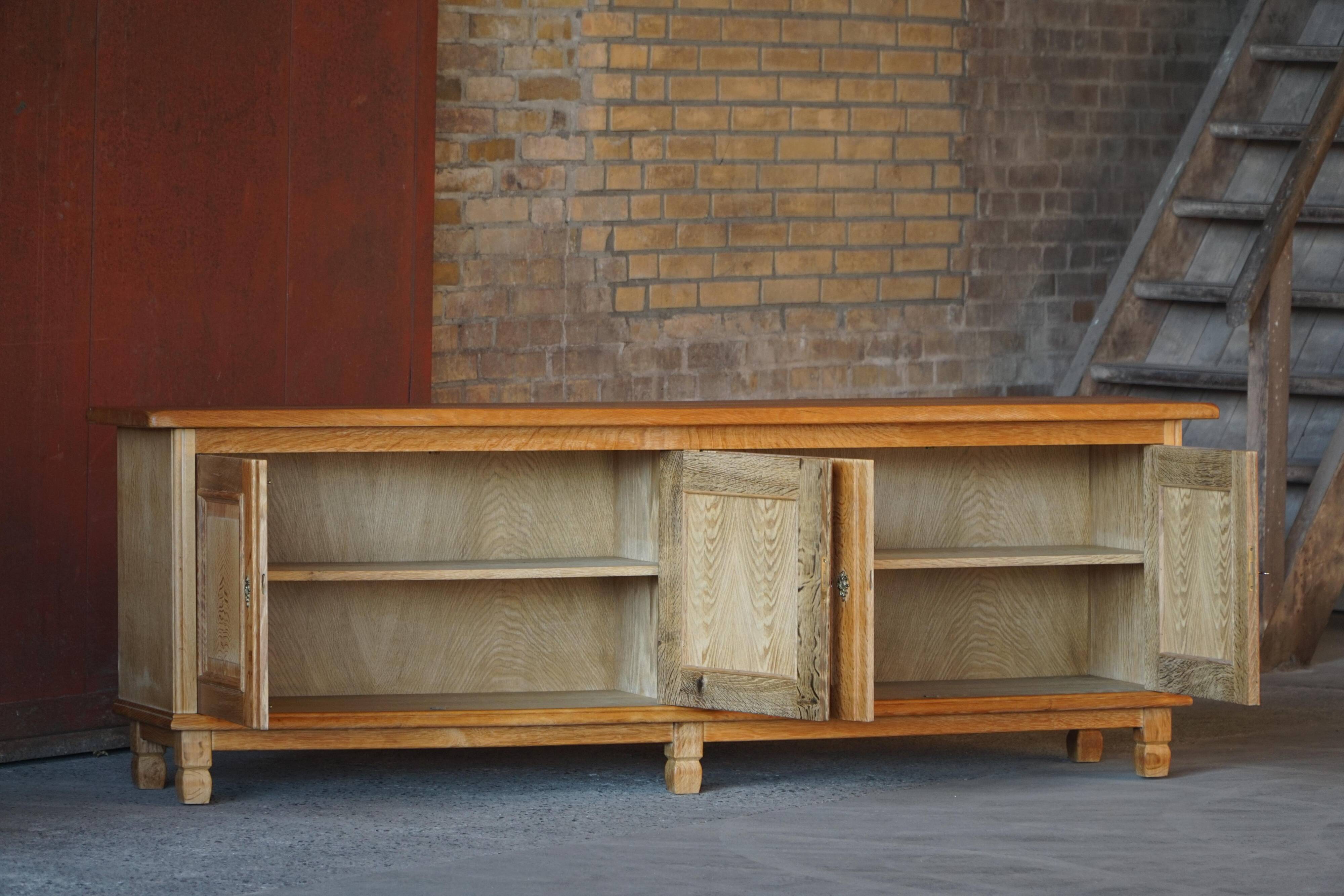 Modern Danish low enfilade in oak with panelled doors, mid-20th century.