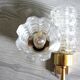 Pair of vintage wall sconces in gilded brass with moulded glass.