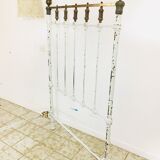 Old white metal and brass bed