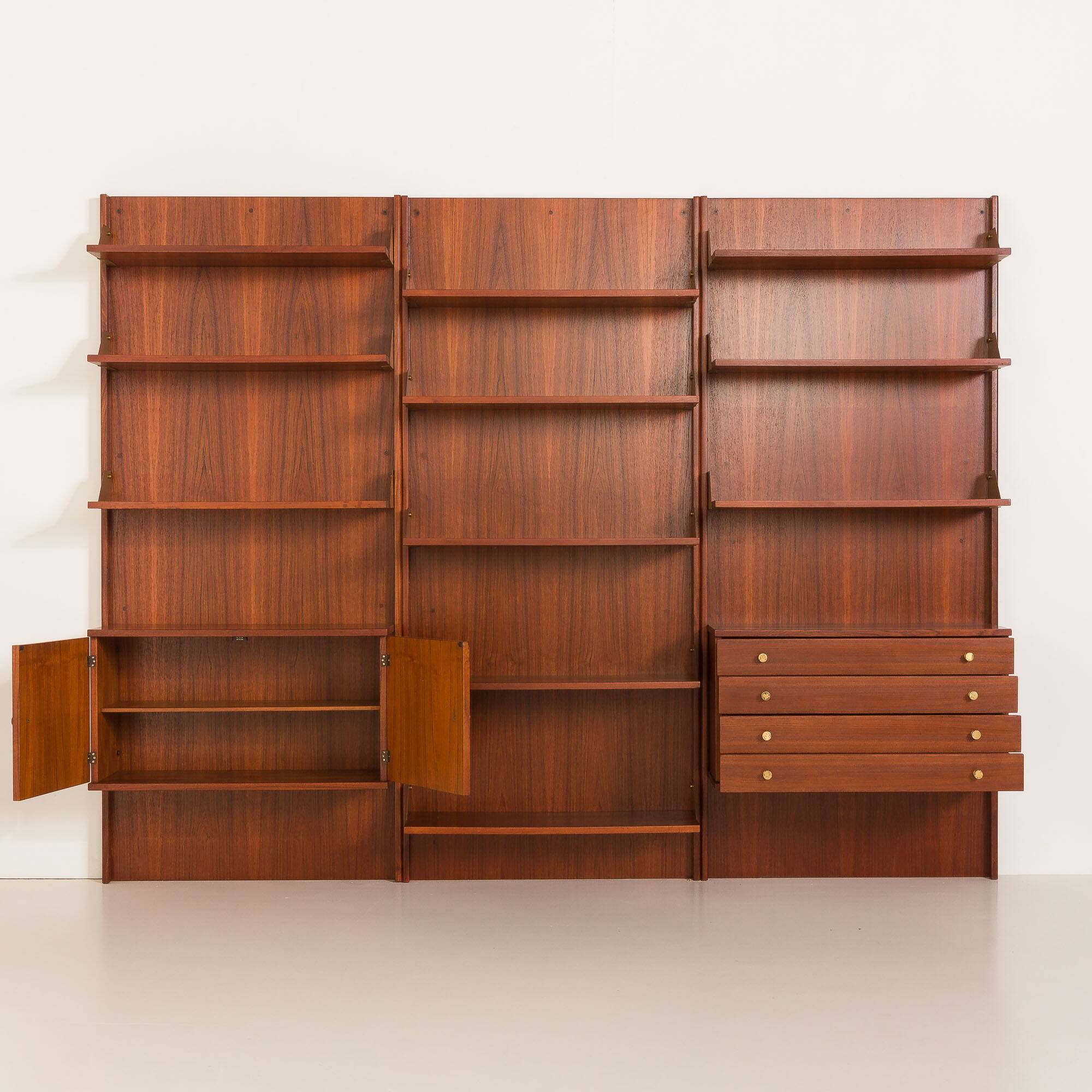 Italian mid-century teak wall unit on panels, 1970s