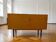 Vintage wooden furniture (chest of drawers, TV unit) with a black frame.