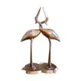 Couple of brass intertwined herons