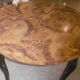 Round table art deco style - elm magnifying glass top and black wooden legs