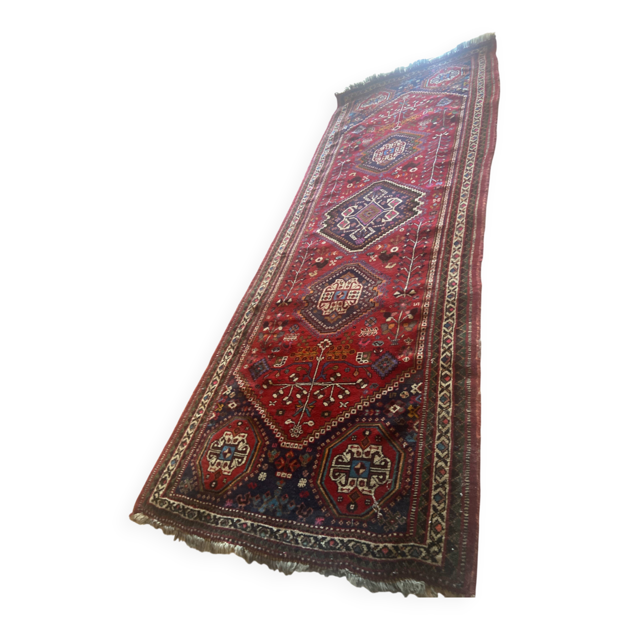 Large antique Oriental hallway carpet made of hand-knotted wool.
