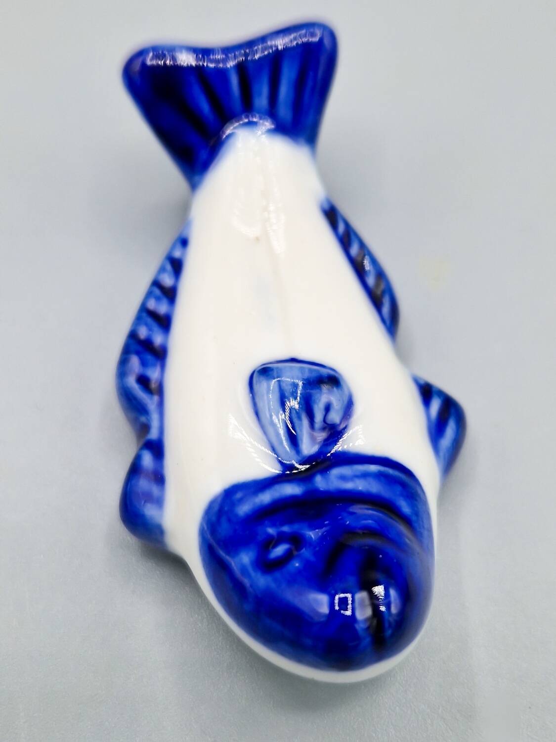 Set of 11 vintage blue and white porcelain fish knife rests.