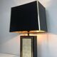 Large lamp in black lacquered wood, gilding and mother-of-pearl. French work. Circa 1970